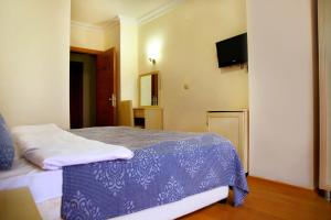 A bed or beds in a room at Miletus Otel Şile