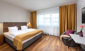 Postel nebo postele na pokoji v ubytování SORAT Hotel Berlin + 27 fotografií