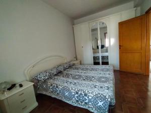Łóżko lub łóżka w pokoju w obiekcie La Casa Bianca - Alghero Calich
