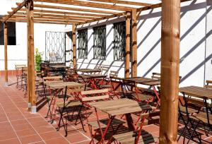 a group of tables and chairs on a patio at Batalhoz House in Cartaxo