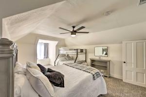a bedroom with a bed and a ceiling fan at Riverside House with Yard about 1 Mi to Downtown! in Riverside