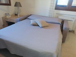 Postel nebo postele na pokoji v ubytování La LocanDina