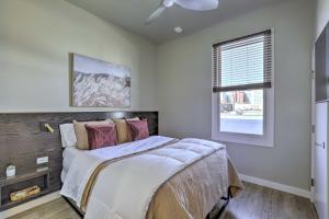 a bedroom with a bed and a window at Stylish San Marcos Apt in the Heart of Dwtn! in San Marcos