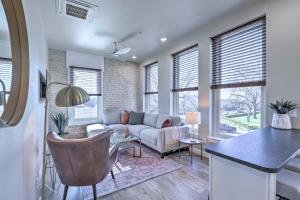 a living room with a couch and a table at Sleek, Newly Updated Downtown San Marcos Apt! in San Marcos