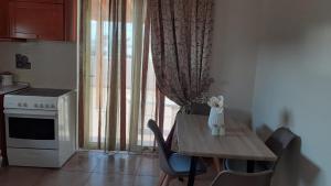 Kuchyňa alebo kuchynka v ubytovaní ILIANA.APARTMENTS