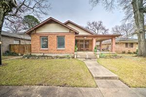a brick house with a porch and a driveway at Texarkana Pet-Friendly Pad with Fenced Backyard in Texarkana