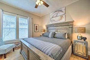 a bedroom with a bed and a ceiling fan at Texarkana Pet-Friendly Pad with Fenced Backyard in Texarkana