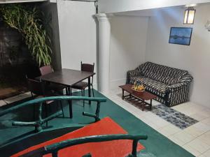 a living room with a table and a couch at City Paradise Dambulla in Dambulla