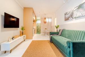 TV a/nebo společenská místnost v ubytování VT06 Apartamento Quarto/Sala - Vilas do Atlântico