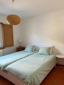 Postel nebo postele na pokoji v ubytování Casa do Rio