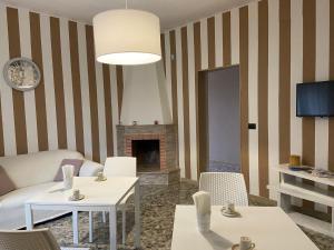 a living room with a couch and a fireplace at House Villa Anna in Polignano a Mare