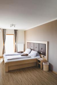 Säng eller sängar i ett rum på Weingut Peter Grill