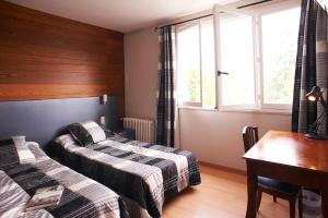 Krevet ili kreveti u jedinici u okviru objekta Hotel La Longue Vue