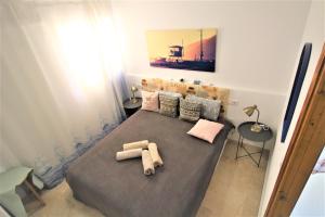 Posteľ alebo postele v izbe v ubytovaní Residence Vacanza Torre Montecarlo + 17 fotografií