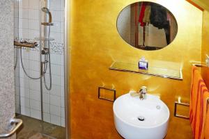 a bathroom with a sink and a mirror at Scenic Village Home with Lake Panorama in Sainte-Croix-de-Verdon +27 photos