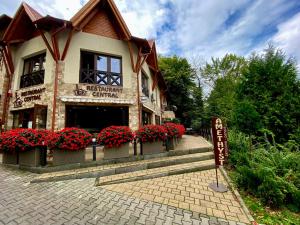 a building with a sign in front of it at Amethyst in Sovata