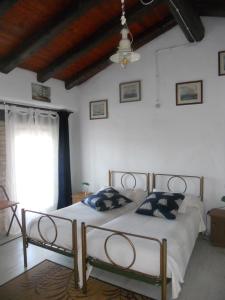 Voodi või voodid majutusasutuse Albergo Julienne toas