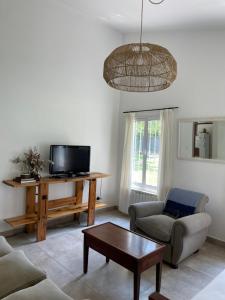 Μια τηλεόραση ή/και κέντρο ψυχαγωγίας στο DIVINA Y COMODA CASA EN SAN LORENZO PARA 5 PERSONAS!! +33 φωτογραφίες