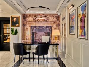 a dining room with a table and chairs at Hotel Teatro Boutique Old Town in Warsaw