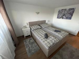 Posteľ alebo postele v izbe v ubytovaní Malibu Apartman + 1 fotografia