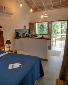 a room with a table with a blue table cloth on it at Pousada Santa Vila in Serra do Cipo