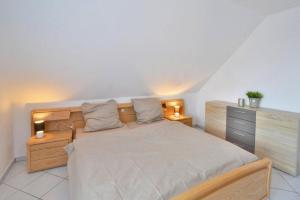 מיטה או מיטות בחדר ב-holiday home, Wicie