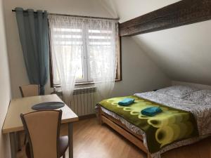 Postel nebo postele na pokoji v ubytování Domek Kozia Grapka + 26 fotografií