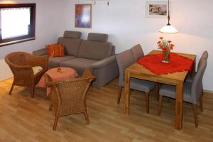a living room with a couch and a table at Apartment, Hornberg in Niederwasser