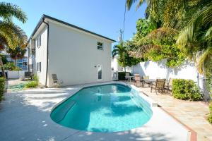 a swimming pool in the backyard of a house at Canal 315 - Right in Siesta Key Village! in Siesta Key