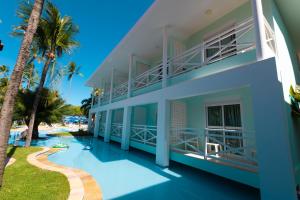 a view of the side of a house with a swimming pool at Baía Branca Beach Resort in Tamandaré