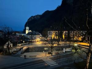 a view of a city at night with lights at Zimmer & Appartements am Schloßplatz in Hohenems