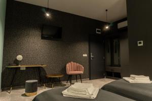 Televiisor ja/või meelelahutuskeskus majutusasutuses Pensiunea Qubik Praid +79 fotot