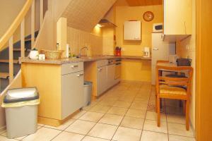 a small kitchen with a sink and a counter at Apartment, Beetzseeheide in Ketzür