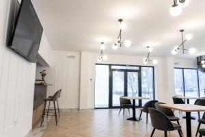 Televiisor ja/või meelelahutuskeskus majutusasutuses Pensiunea Qubik Praid