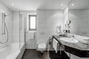 Kúpeľňa v ubytovaní Sporthotel Olymp