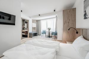 Posteľ alebo postele v izbe v ubytovaní Sporthotel Olymp