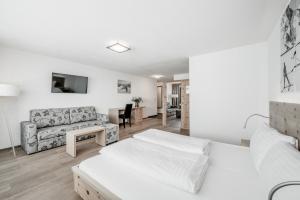 Posteľ alebo postele v izbe v ubytovaní Sporthotel Olymp