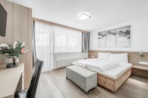 Posteľ alebo postele v izbe v ubytovaní Sporthotel Olymp