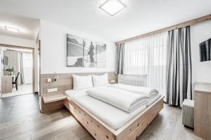 Posteľ alebo postele v izbe v ubytovaní Sporthotel Olymp