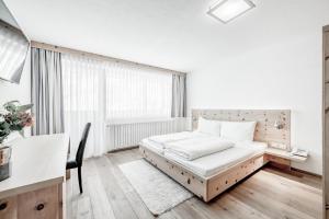 Posteľ alebo postele v izbe v ubytovaní Sporthotel Olymp
