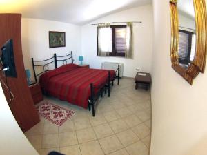 Postel nebo postele na pokoji v ubytování B&B Su Tintillu