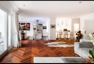 a living room with a hardwood floor and white walls at LUXURY PENTHOUSE ☆ ☆ ☆ ☆ ☆ in Cologne