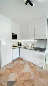 A kitchen or kitchenette at Apartamento Romana Playa