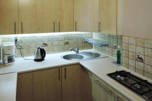 a kitchen with a sink and a counter top at Terraced house, Rewal in Rewal