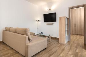A television and/or entertainment centre at Theros Luxury Apartment