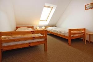 two bunk beds in a room with a window at Holiday resort in the Müritz National Park, Mirow in Mirow