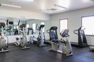 a gym with several treadmills and elliptical machines at Francis Scott Key Family Resort in Ocean City