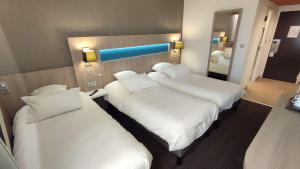 Postel nebo postele na pokoji v ubytování Best Western Marseille Aeroport