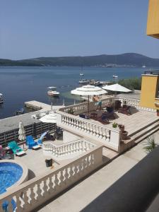 a view of a resort with a swimming pool and the water at Pontus Luxury Apartments in Tivat