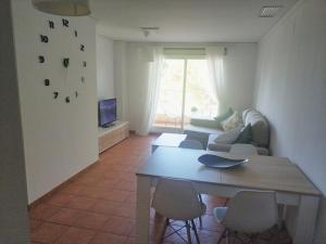 A seating area at MET&GOLF OLIVA NOVA BEACH JARDIN